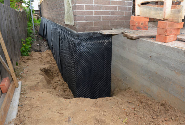 SJ Waterproofing Pros technician performing targeted Interior Drainage System assessment in Wickliffe, OH